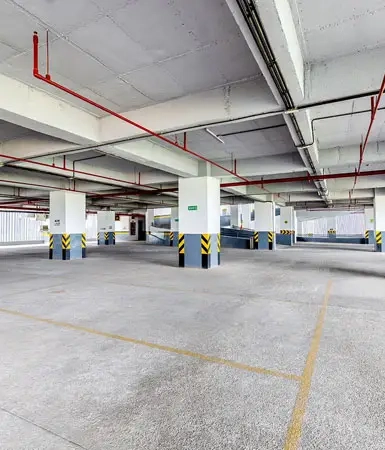 Spacious parking area at Good Earth Business Bay I, Gurugram, featuring designated spaces and clear markings for convenient parking.