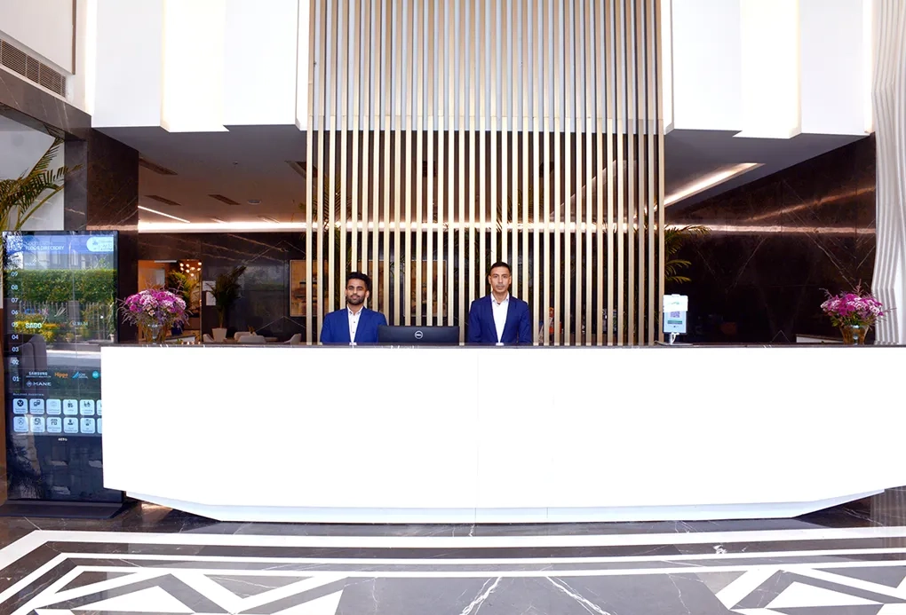 Front desk reception area at Good Earth Infra, showcasing a sleek and professional environment for commercial real estate services.