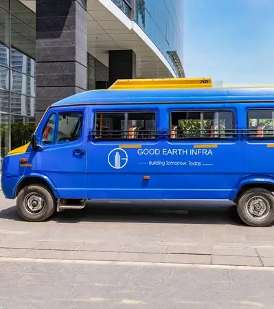 Shuttle bus outside Good Earth Trade Tower, providing convenient transport to the nearby Metro Station for employees and tenants.